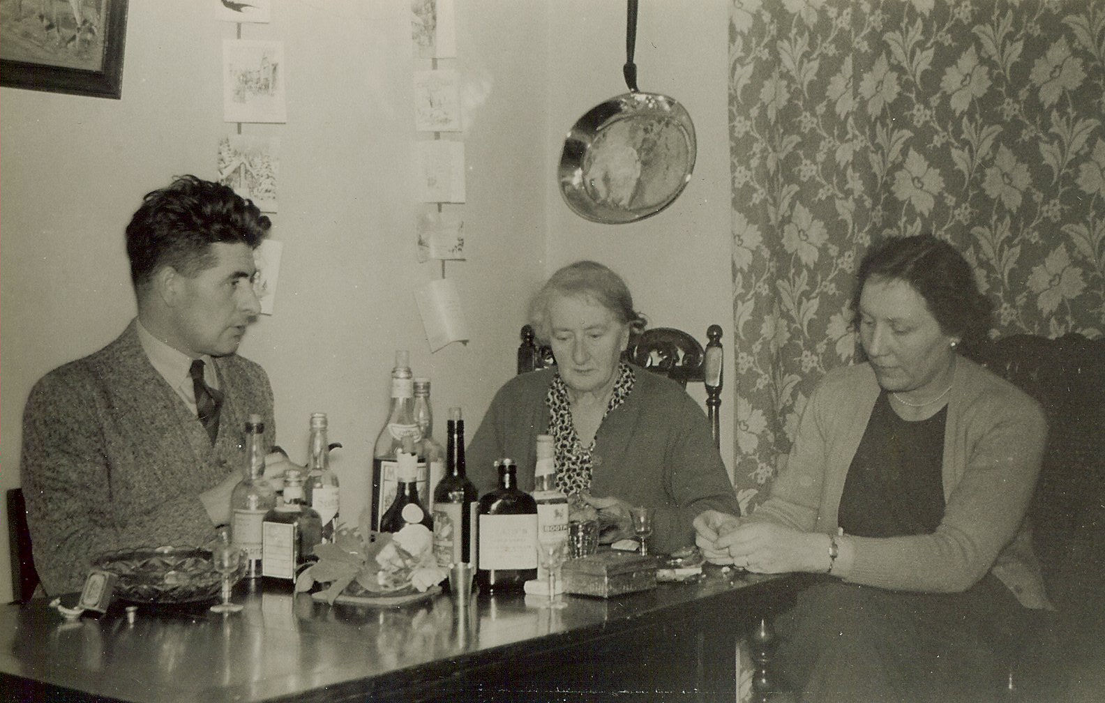 John, Emily and Georgina Riley sat around a table one Christmas.