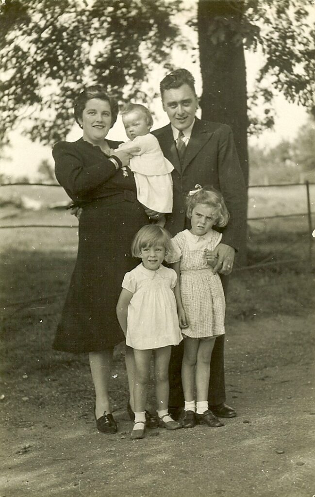Len posing with his young family.